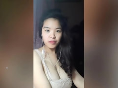 Vietnam brunette bares her big boobs to play with them
