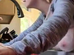 Bent over the kitchen sink