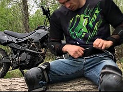 Handsome BIKER RIDING A MOTORCYCLE IN THE FOREST HANDKS AND CUMES IN PUBLIC