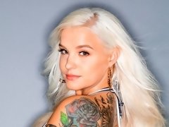 Elegant blonde with tattoos Bella Jane enjoys intensive anal sex