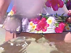 Beach bitch pissing in the sea in public