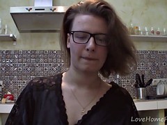 Solo girl with glasses chatting in the kitchen