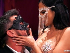 Masked dude invites a busty brunette to ride his cock