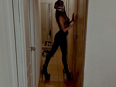 Mistress in heels in fetish leather pants